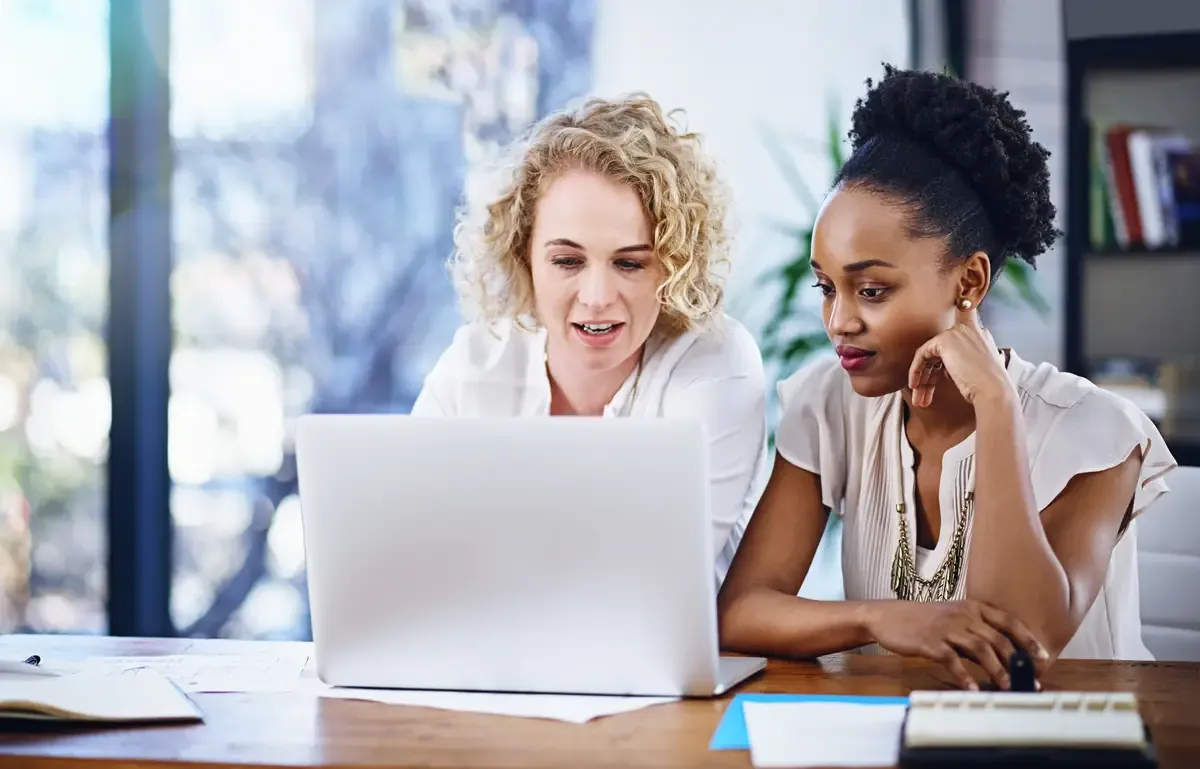 Business research and women with laptop in office for support collaboration or consulting for help or advice Solution teamwork and digital marketing team with pc or creative idea or inspiration